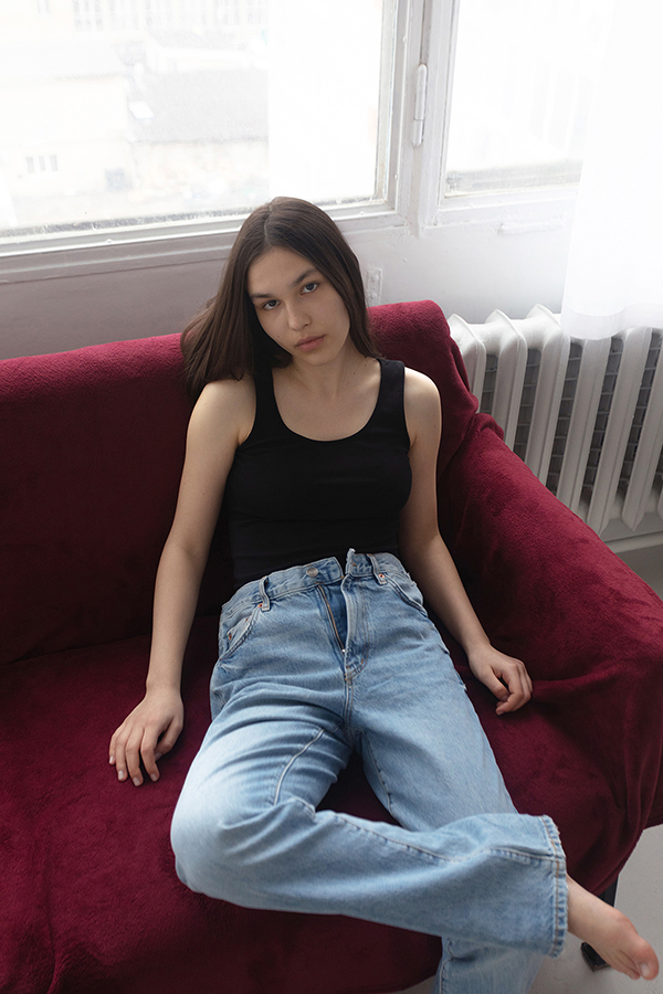 Professional photoshoot on a red sofa