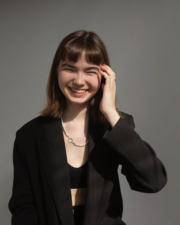 Girl's smiling and wearing black jacket