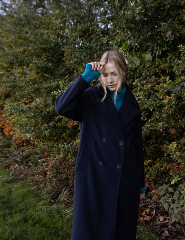 Blue winter coat photoshoot in the park