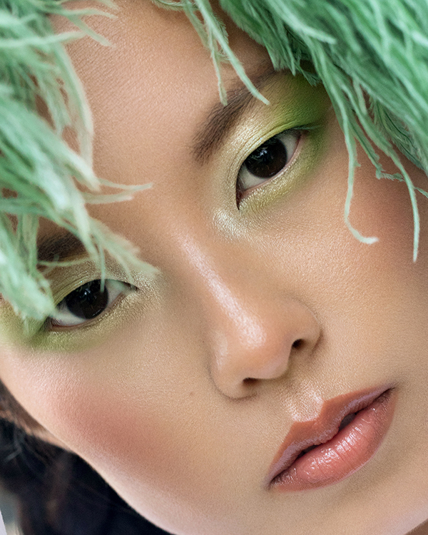 Macro beauty photography with asian model and green eyeshadow