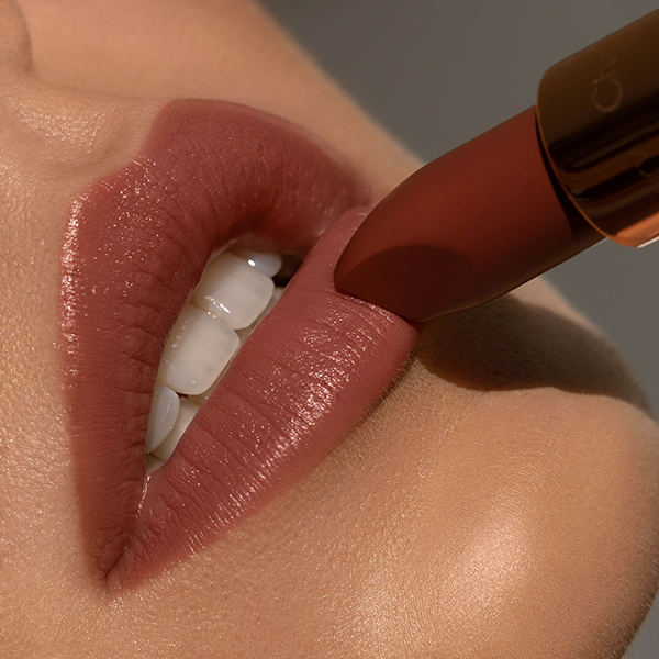 Makeup campaign of Charlotte Tilbury with close up lips and luxury lipstick