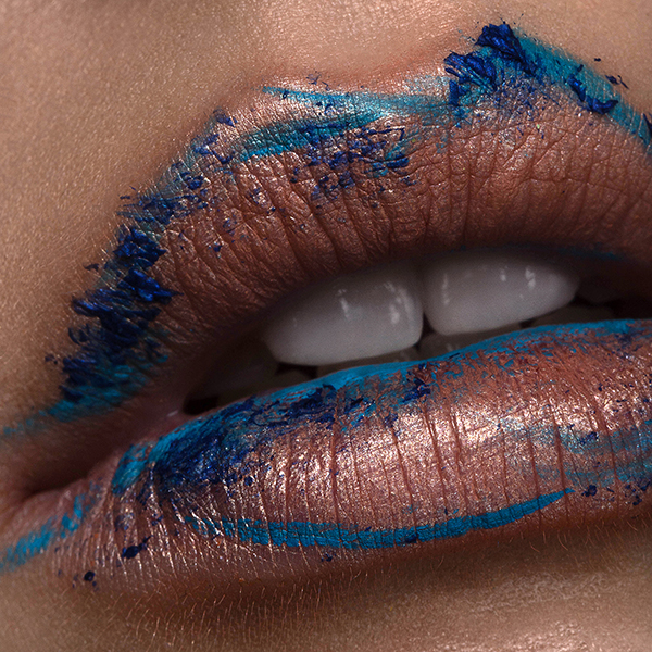 Macro lips with blue impressionist art, made with soft pencil liner and brush