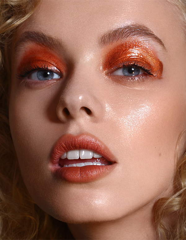 Professional retouching for portrait beauty photography with wet orange eye makeup