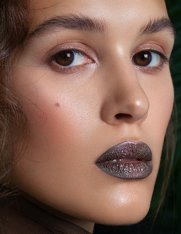 Beauty portrait with nude eyes and dark pigment metallic chrome lips