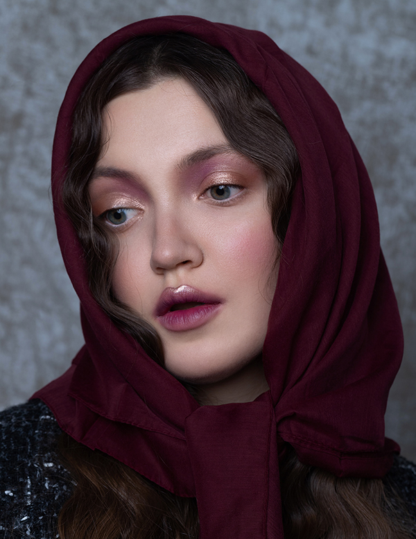 Girl in a red headscarf posing for a magazine